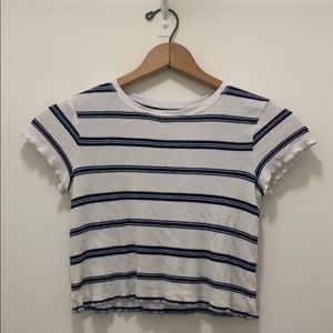 A crop top tee with black stripes.